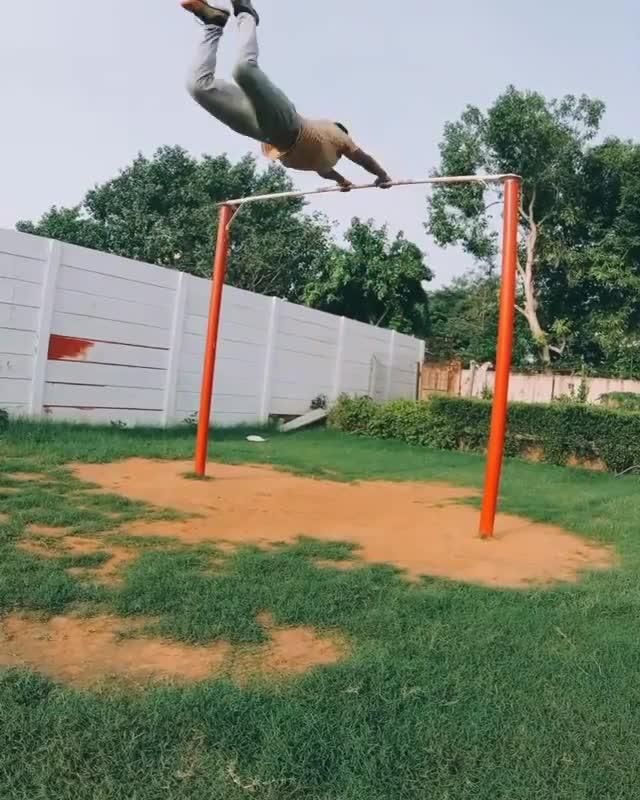 Guy Performs Calisthenics Tricks on High Bar Jukin Licensing