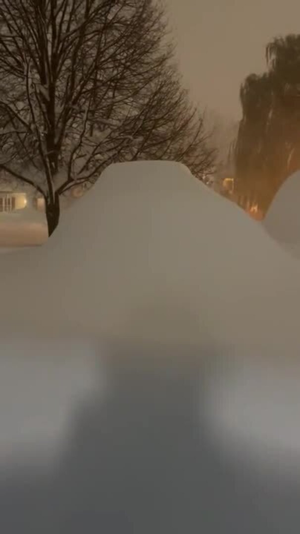 Shutter Opens to Reveal Wall of Snow in Aftermath of Snowstorm in