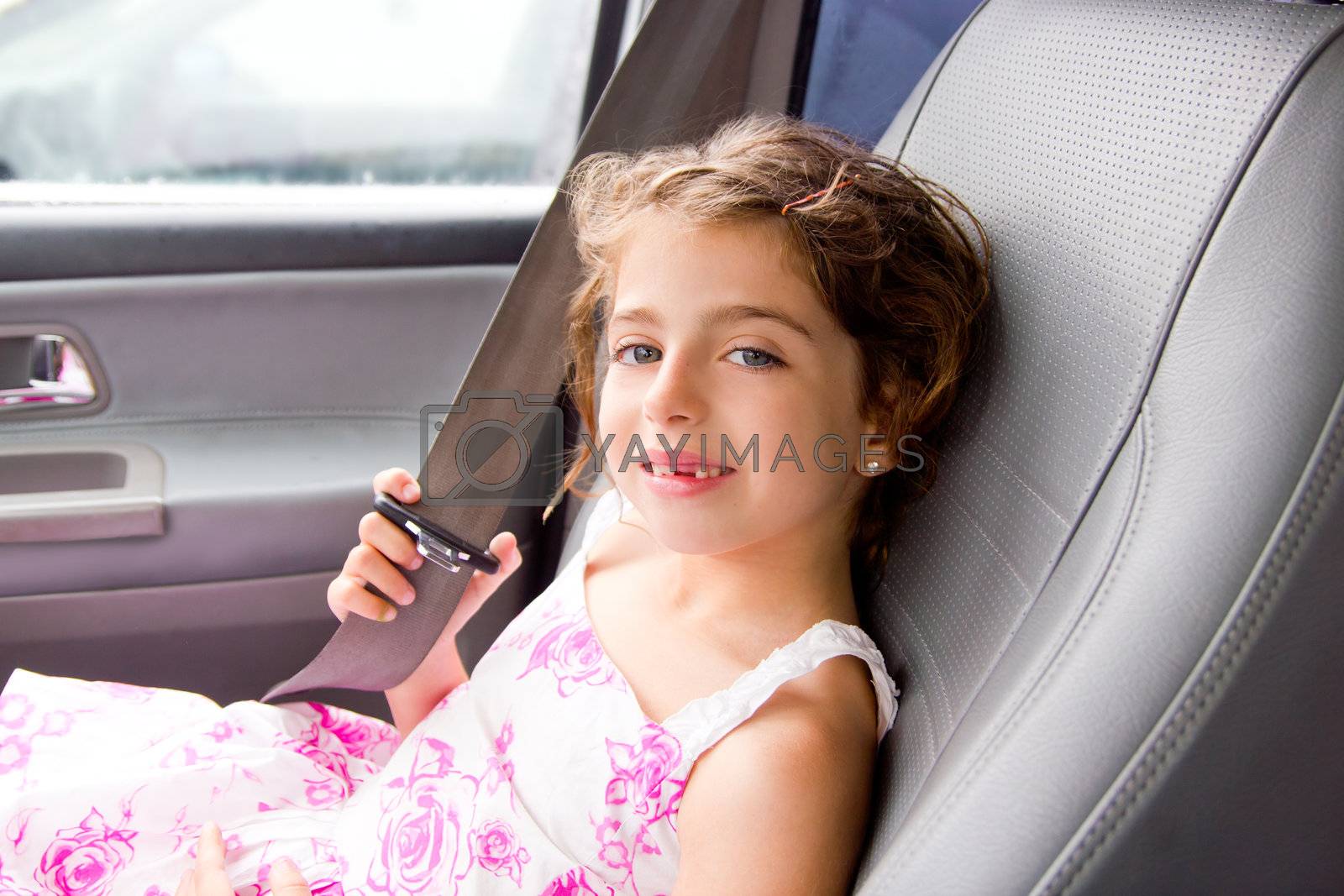 Royalty Free Image child little girl indoor car putting safety belt