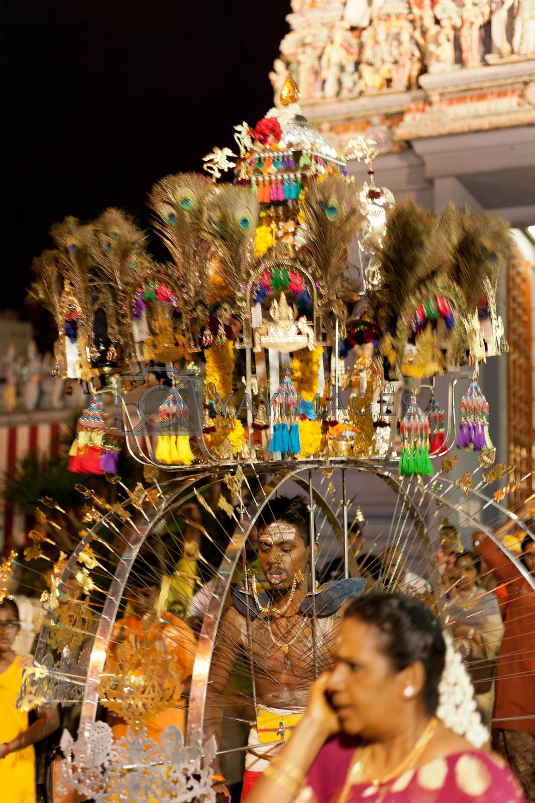 Devotee carrying a kavadi at Thaipusam in Singapore EDITORIAL US by