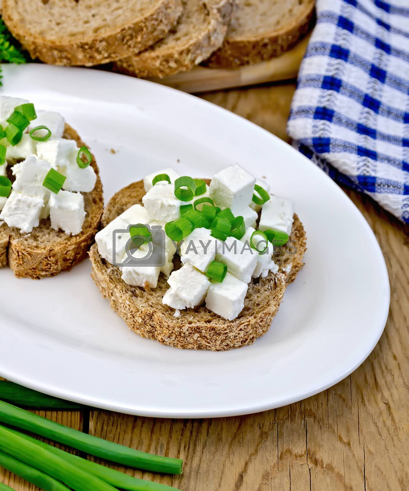 Royalty Free Image Bread with feta and chives on a plate