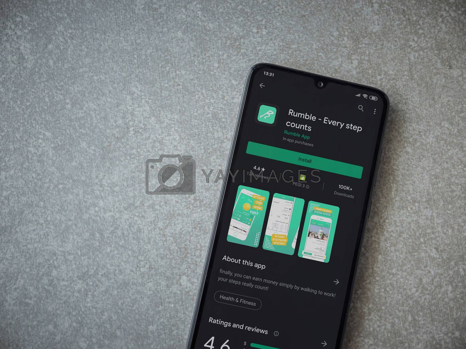 Rumble app play store page on the display of a black mobile smar by