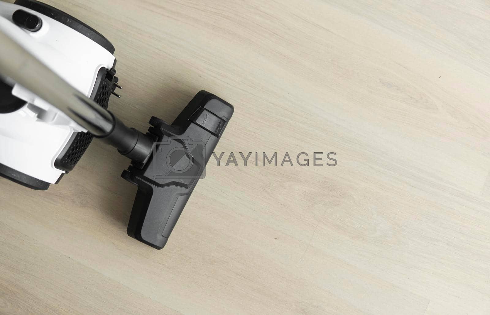 Bagless cyclone vacuum cleaner on a laminate. Electrical apparatus that