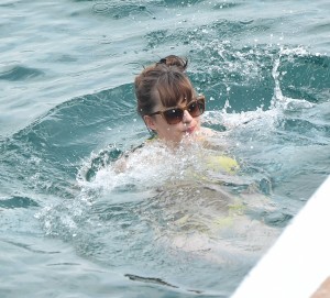 Dakota Johnson - yellow bikini on set of 'Fifty Shades Darker' in St