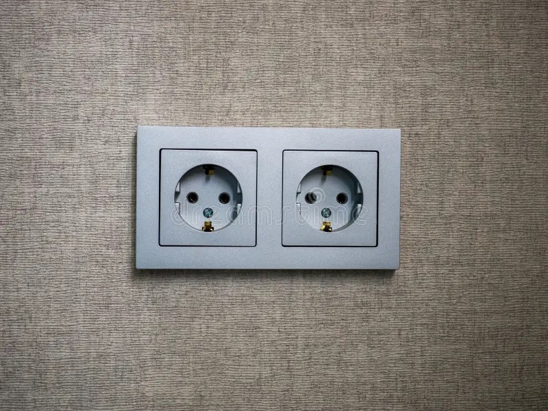 Closeup of a Gray Four Module Socket. Double Electrical Socket