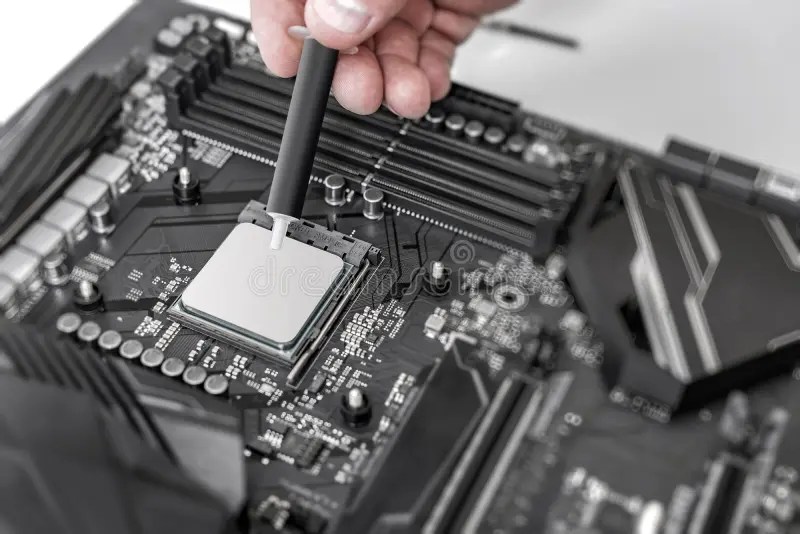 Engineer Applying Thermal Paste on the Computer Board Chip Cpu. Stock