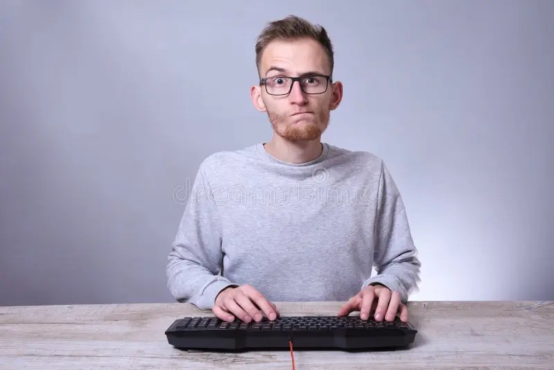 Funny Nerd Young Businessman, Man Working On Computer.Typing On The