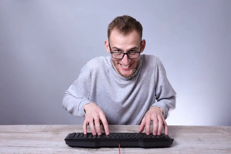 Funny Nerd Young Businessman, Man Working On Computer.Typing On The