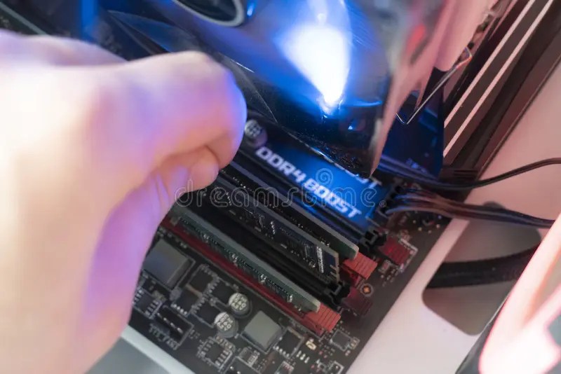 The Inserting Plug in the Ram Ddr Memory Card in the Computer Mainboard