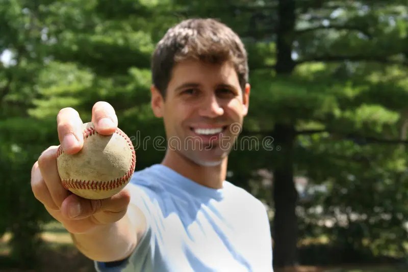 Man Throwing Balls stock photo. Image of yard, playground 7209202