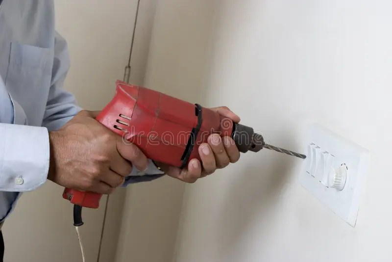 Man using drill machine stock image. Image of drilling 19164469