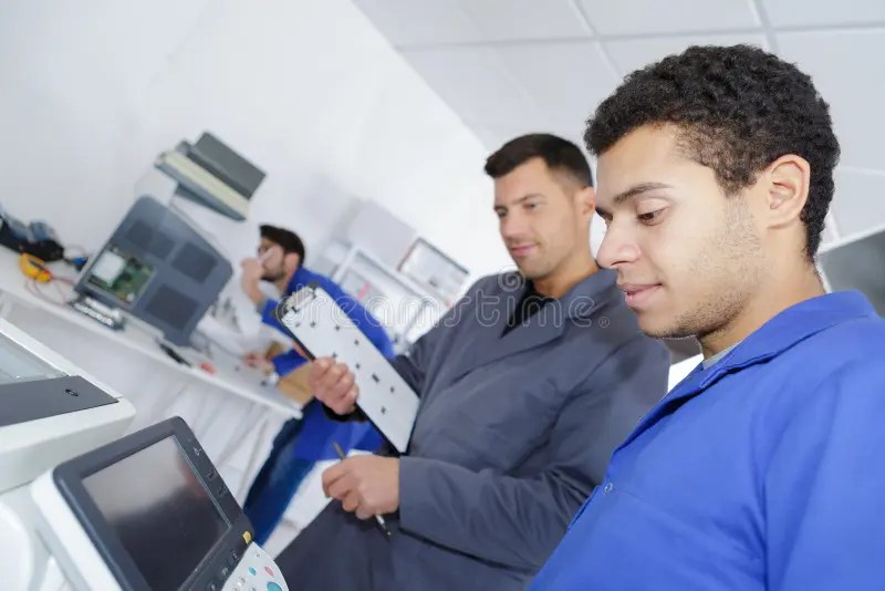 Modern Printing Machine Operator and Apprentice Stock Photo Image of