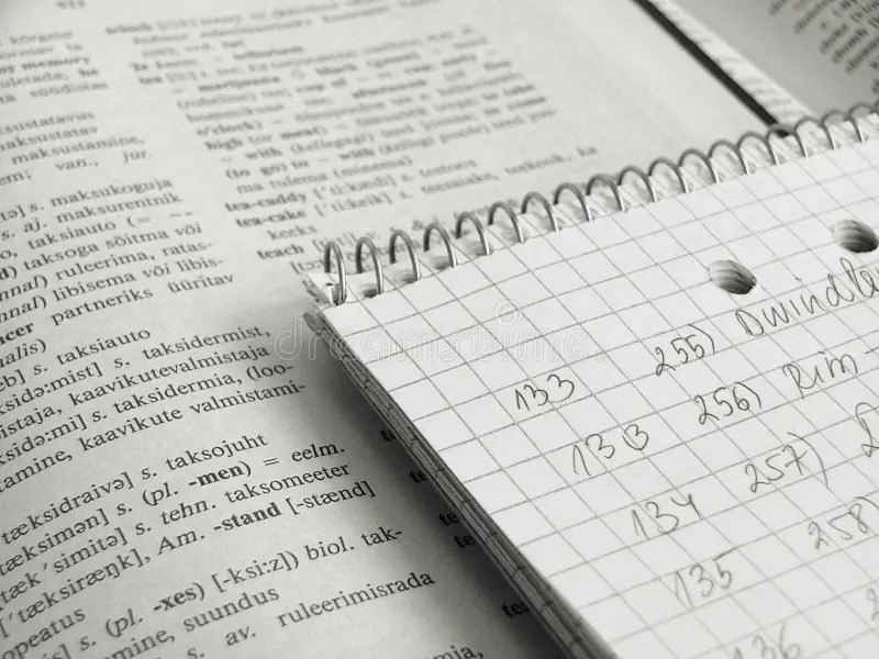 Notepad and a dictionary stock photo. Image of checked 135206