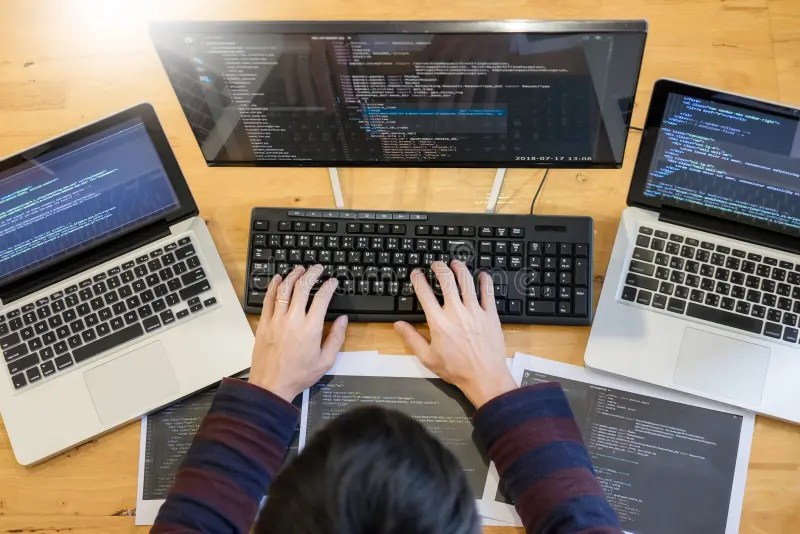 Pensive Programmer Working on on Desktop Pc Programming Code Technologies or site Design at