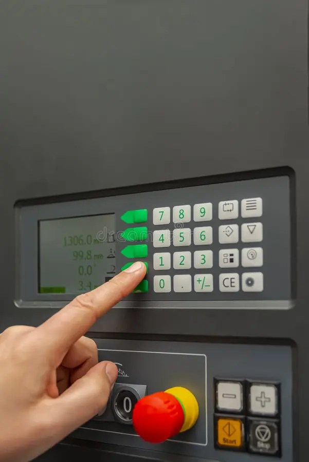 The Process of Programming a CNC Machine. Entering Data into a Computer