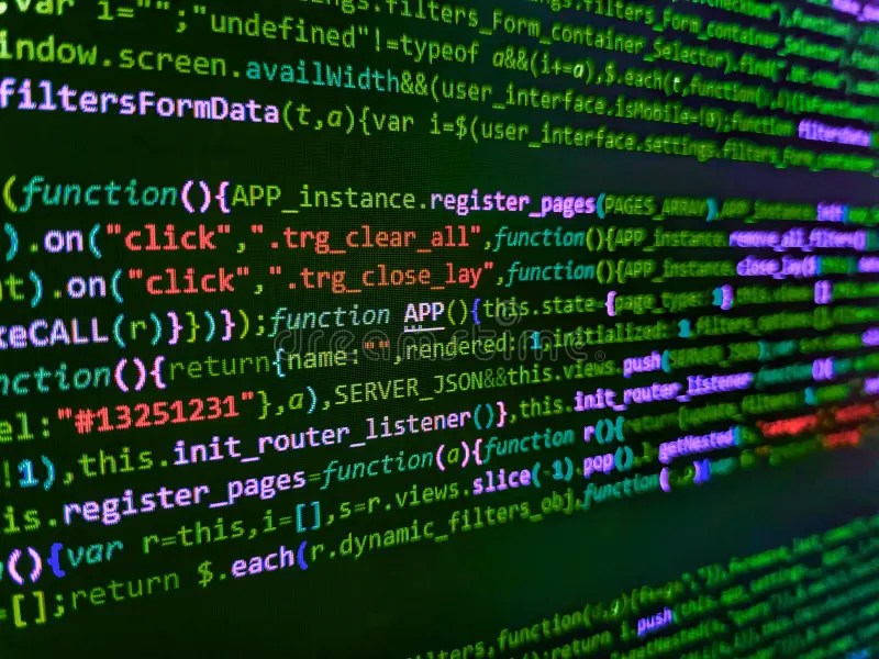 Programmer Working on Computer Screen. Light and Dark Shadow