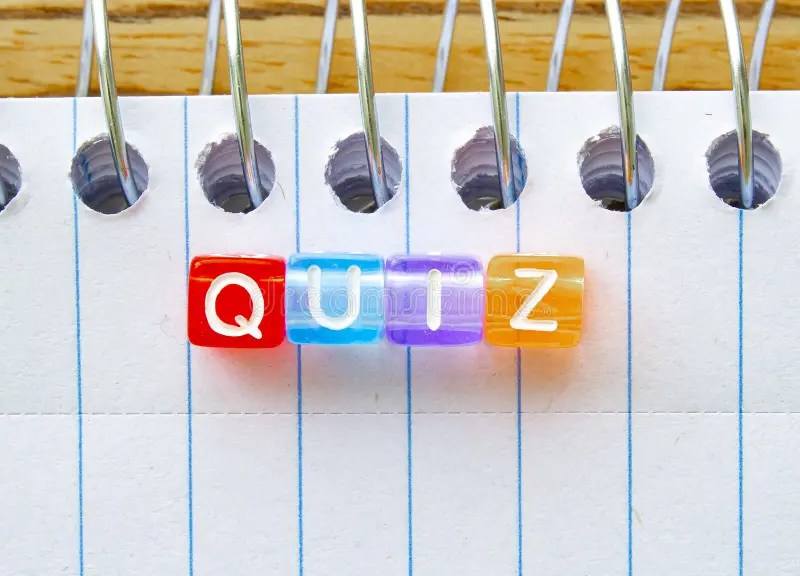 Quiz, Message in Text on Colorful Cubes on a Notebook Stock Image