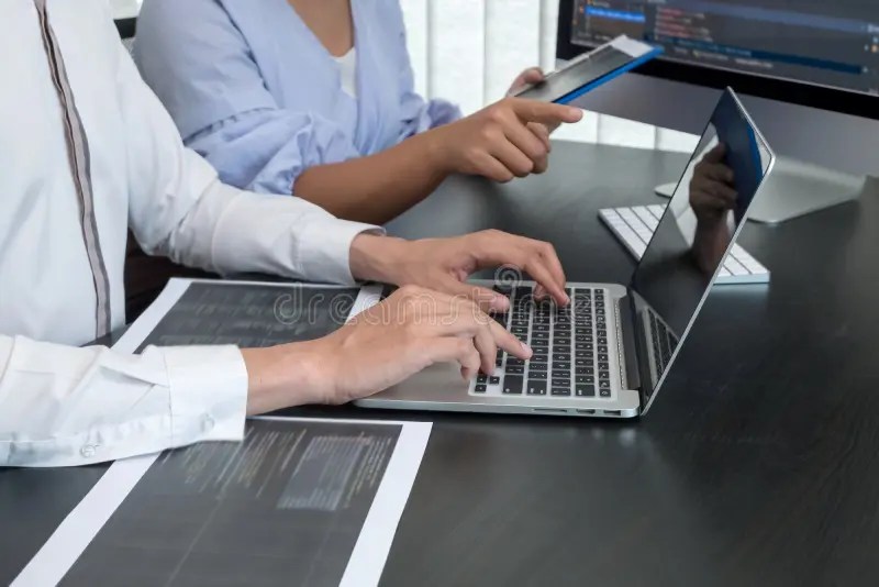 Team of Programmers Working with Computer Programming, Professional Development, and Coding