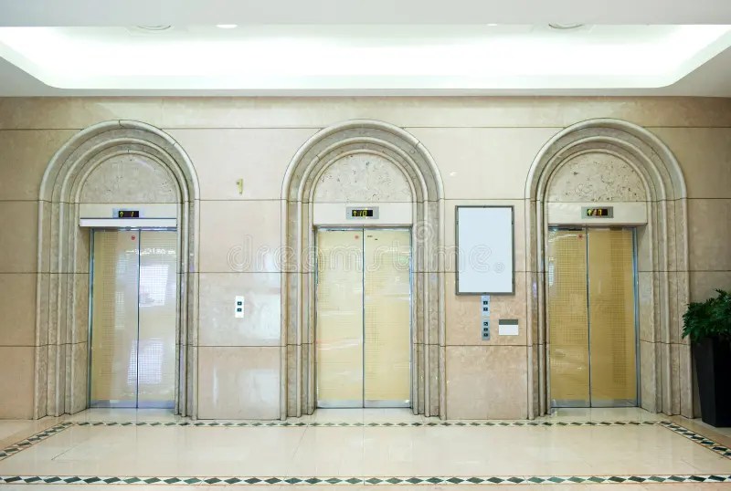 Three Elevator Doors in a Residential Building. Wideangle View of