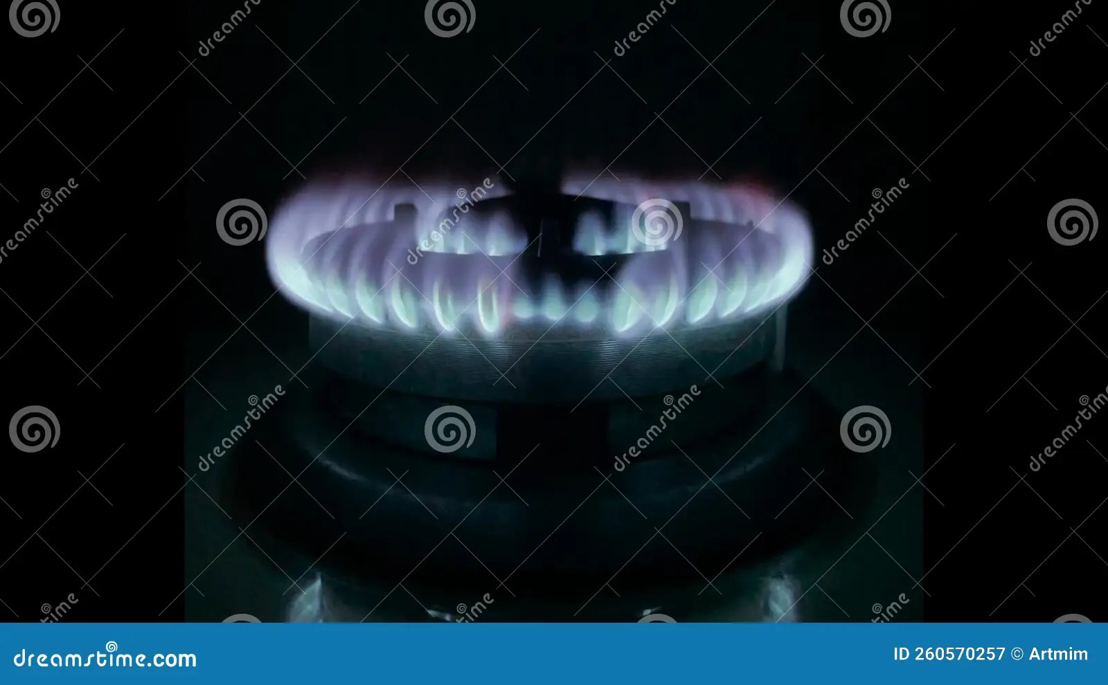 Blue Kitchen Gas Stove Fire with Bright Orange Flashes Decrease