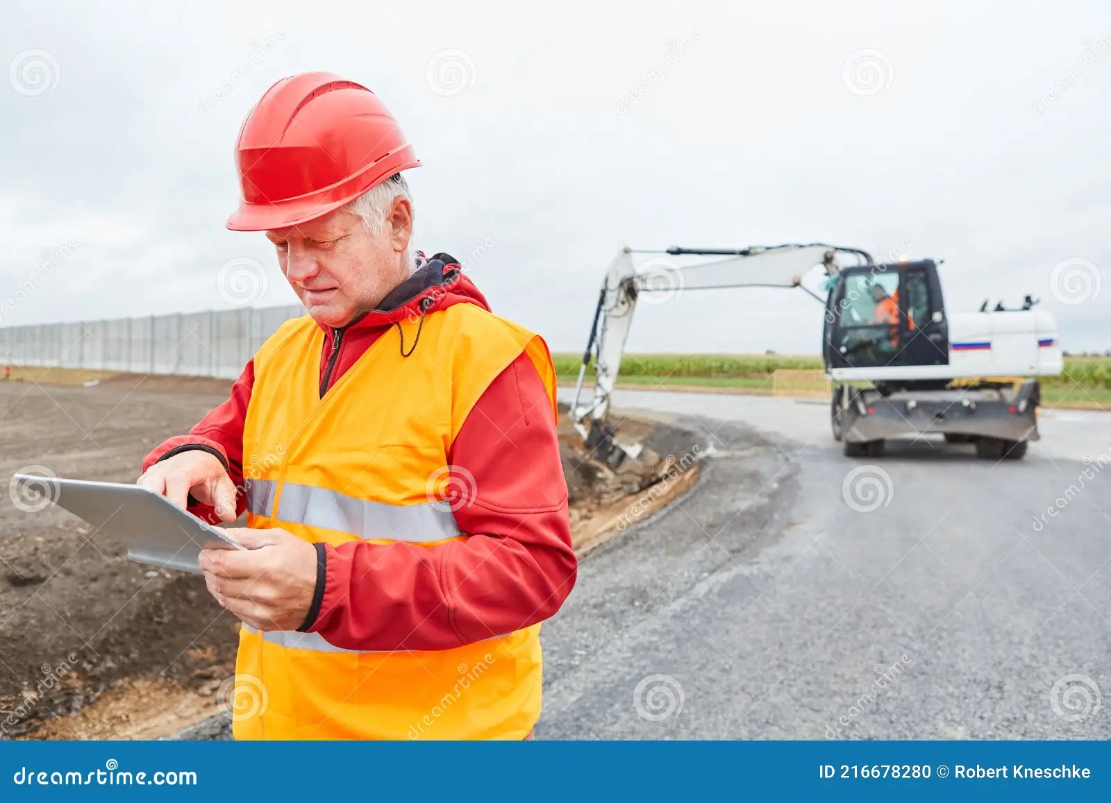 Construction Worker Using Tablet Computer during Construction Planning