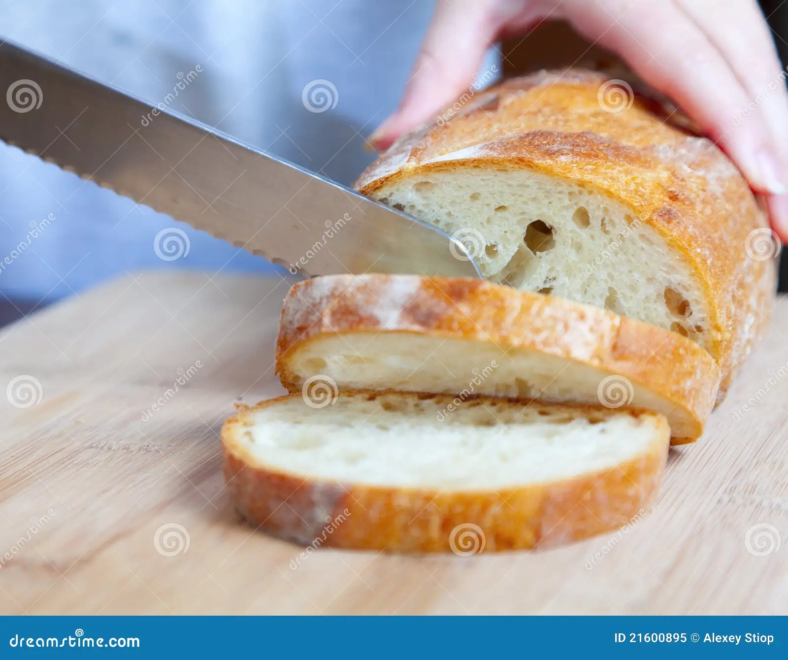 Cutting bread stock image. Image of knife, board, diet