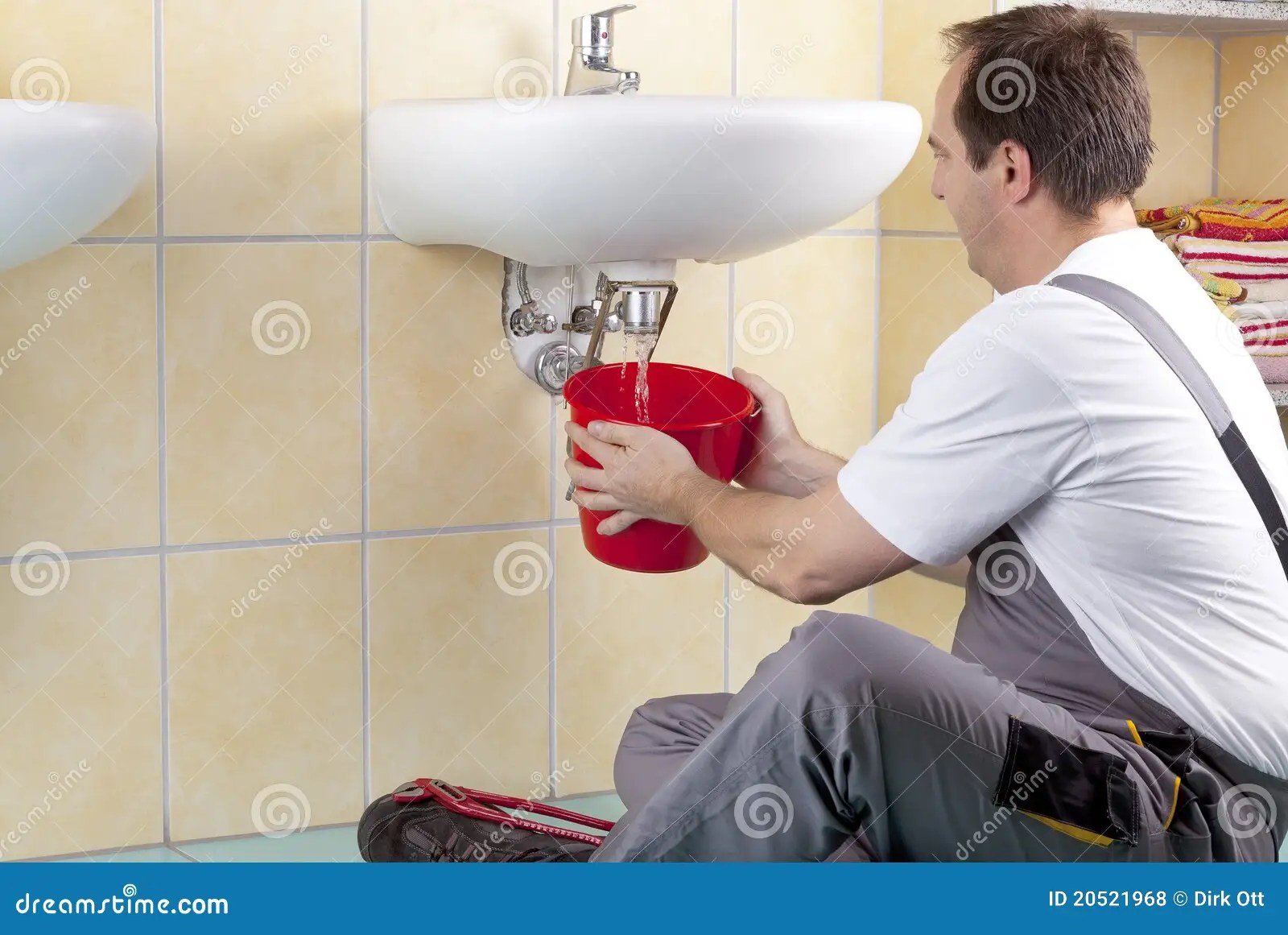 Plumber at work stock photo. Image of pipe, handyman 20521968