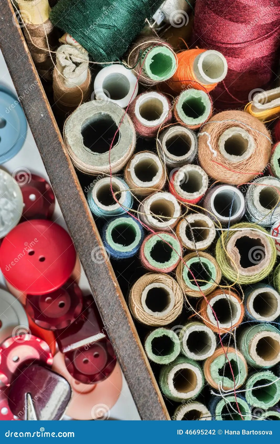 Sewing Kit with Multicolored Knobs and Spools of Thread Stock Photo