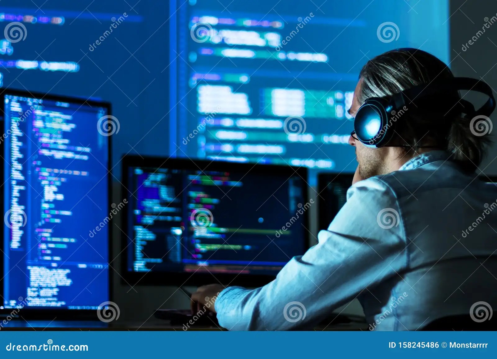 Software Developer, Freelancer Working with Program Code Stock Photo