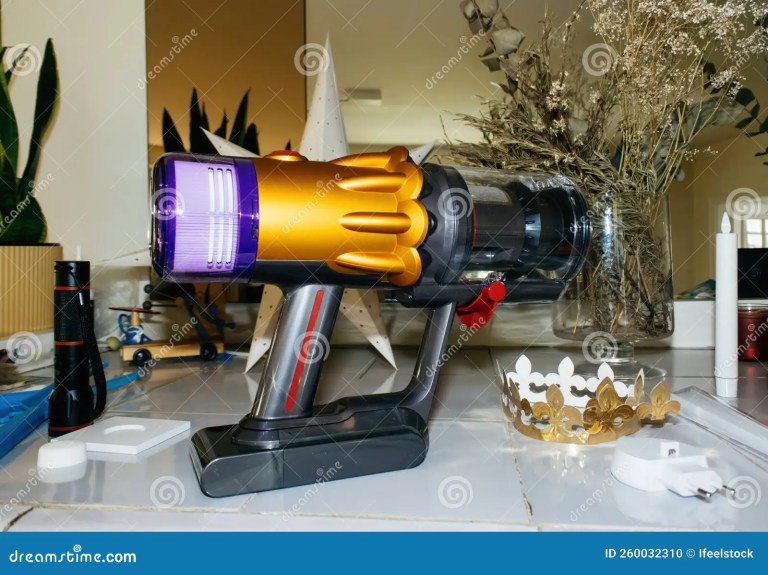 Table with Multiple Objects Main Hero Object New Cordless Vacuum