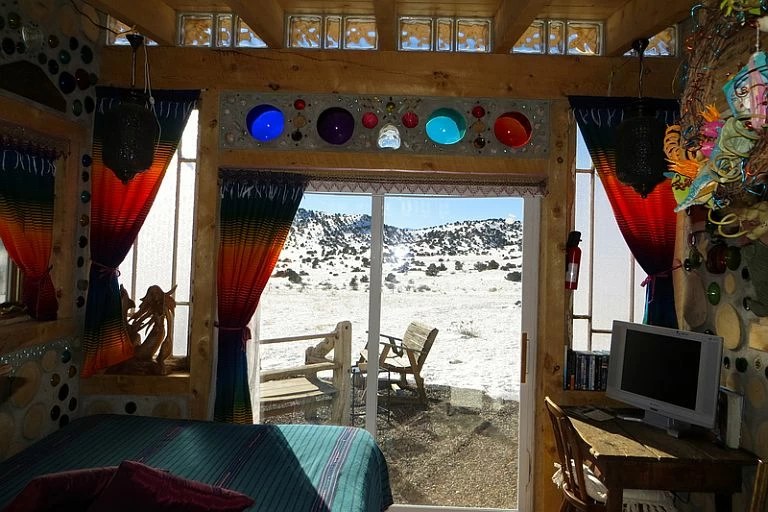 "Mermaid House" Made From Recycled Bottles Looks Like A Kaleidoscope Inside