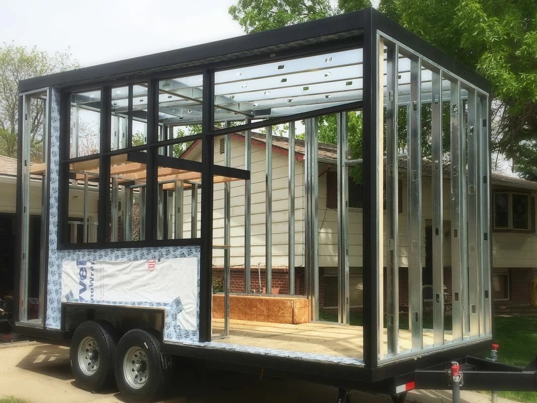 Folding Walls Open To Reveal A Surprisingly Bright And Stylish Tiny Home