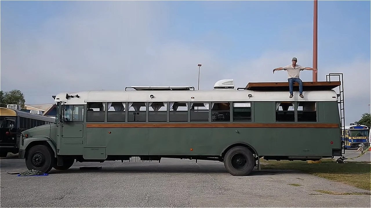School Bus Conversion With a Rooftop Deck That Sleeps Six!
