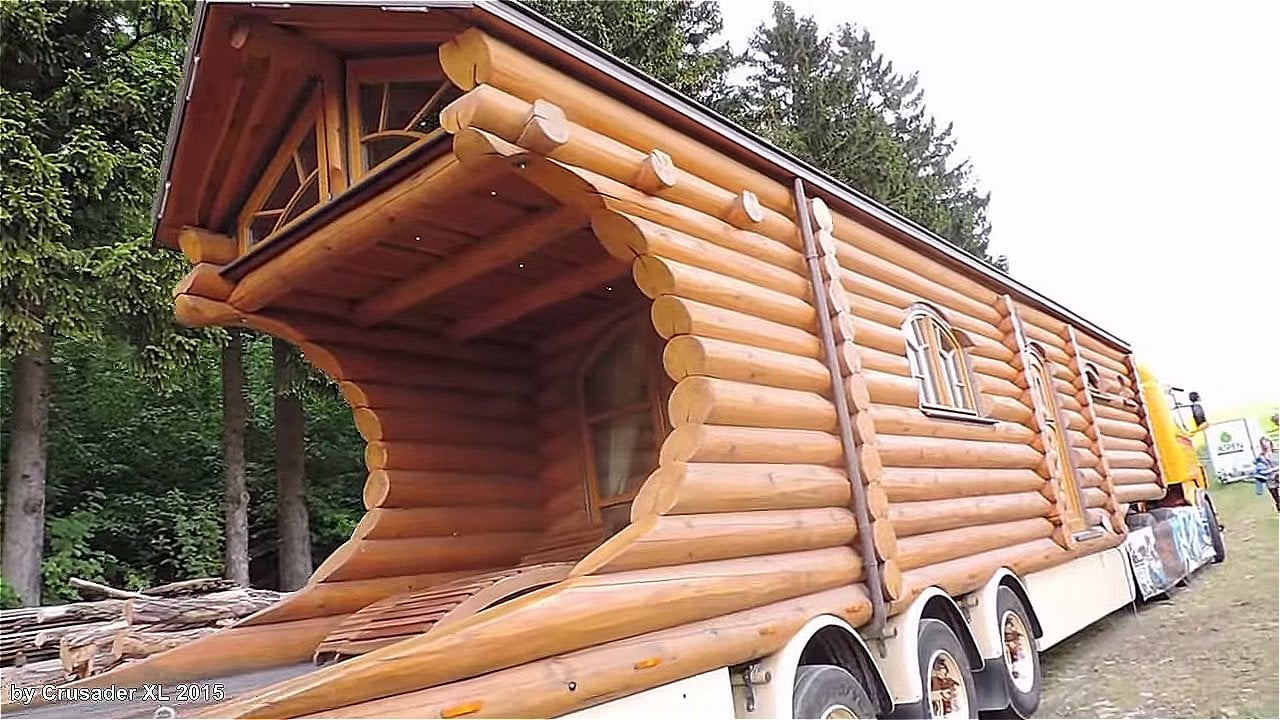 Mobile Log Cabin Pulled by a Semi Truck!