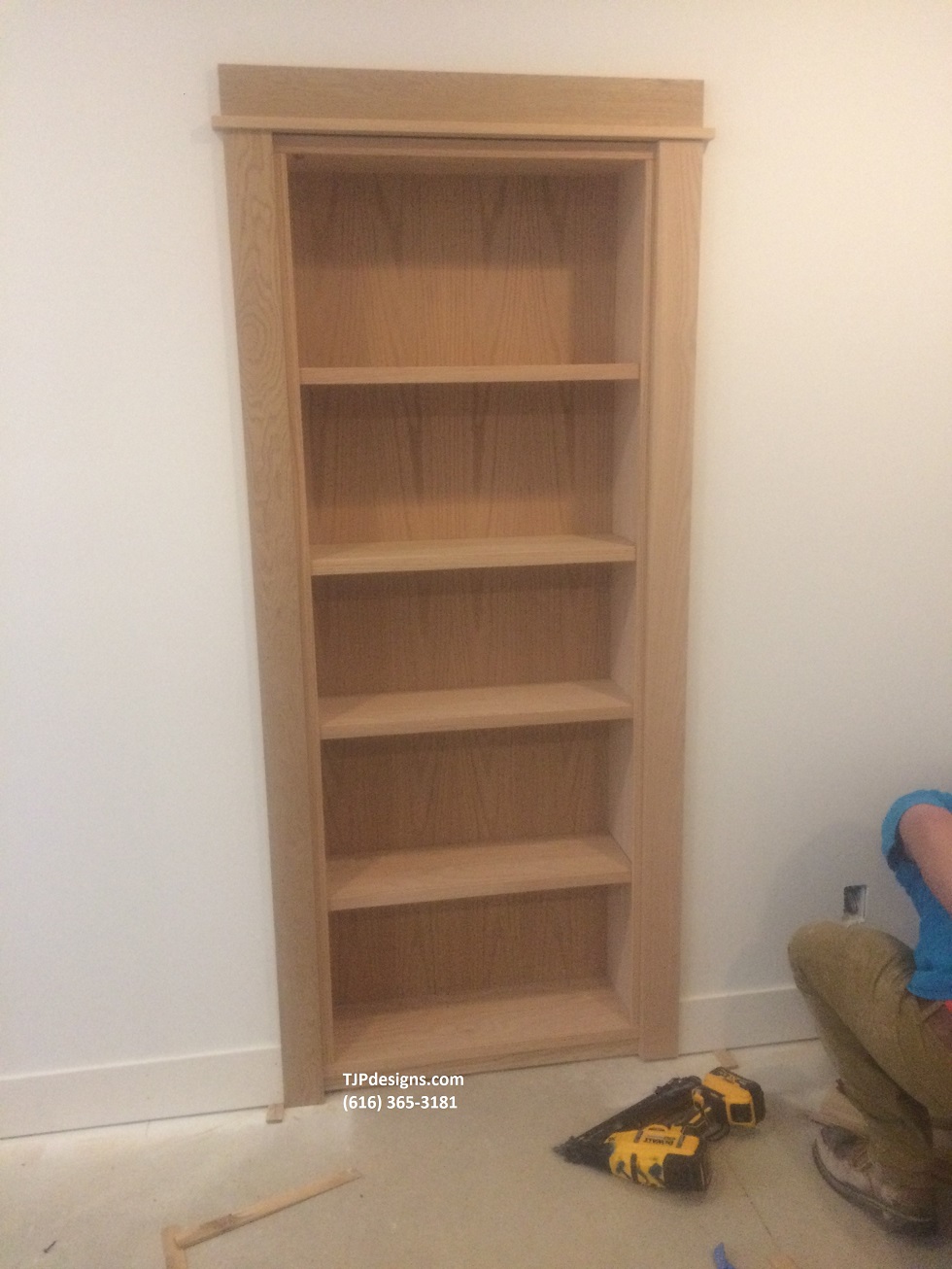 Hidden Bookshelf Door TJP Designs & Construction LLC TJP Designs