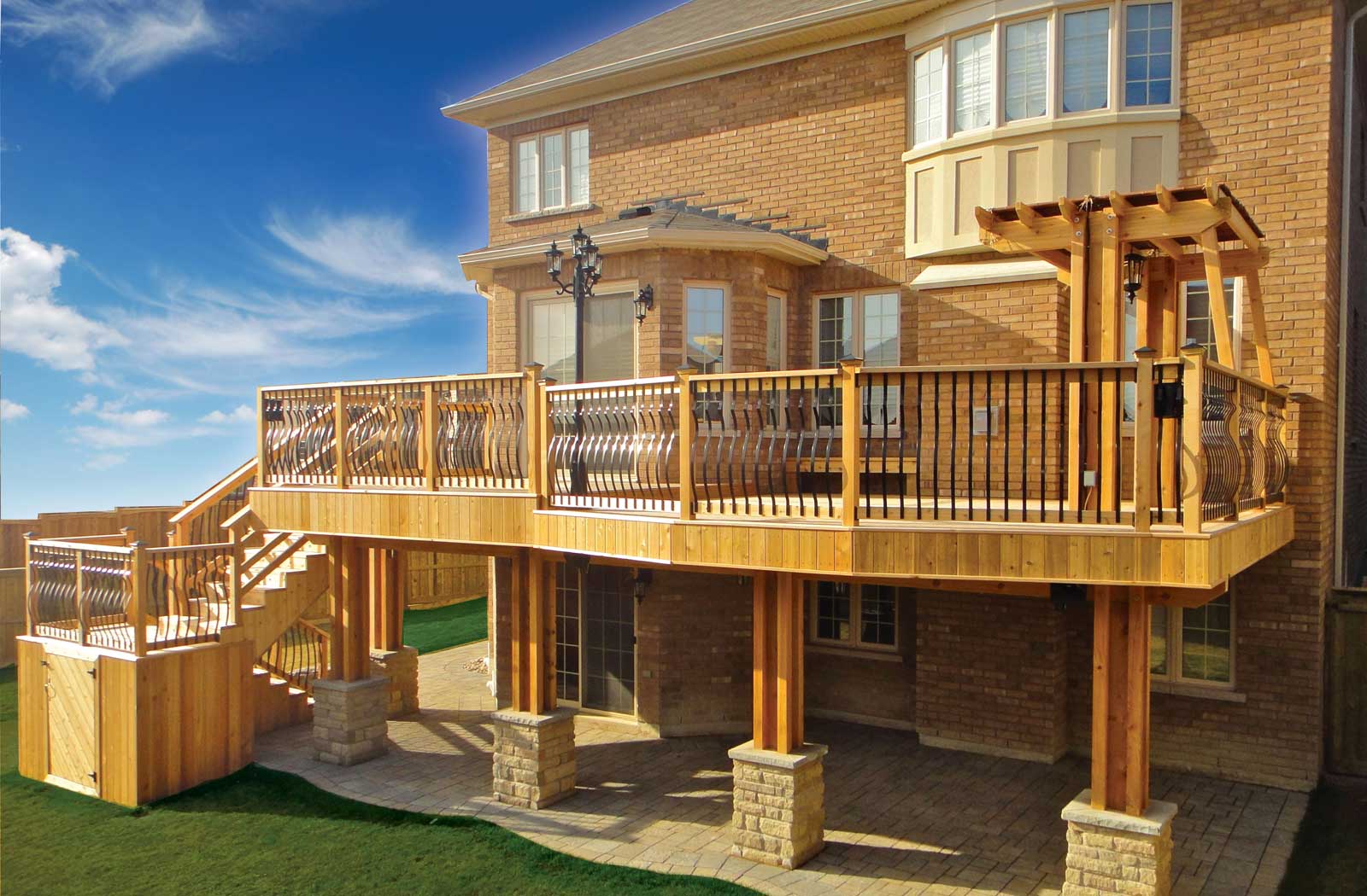 Custom deck with basement walkout interlock Toronto Custom deck
