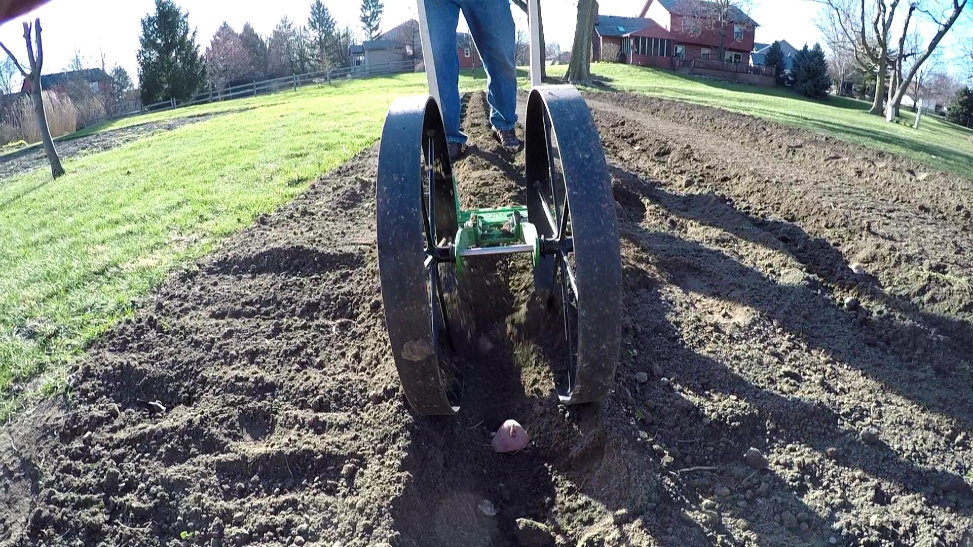 Using the Hoss Wheel Hoe Plow Set to make (and cover) rows Tractor