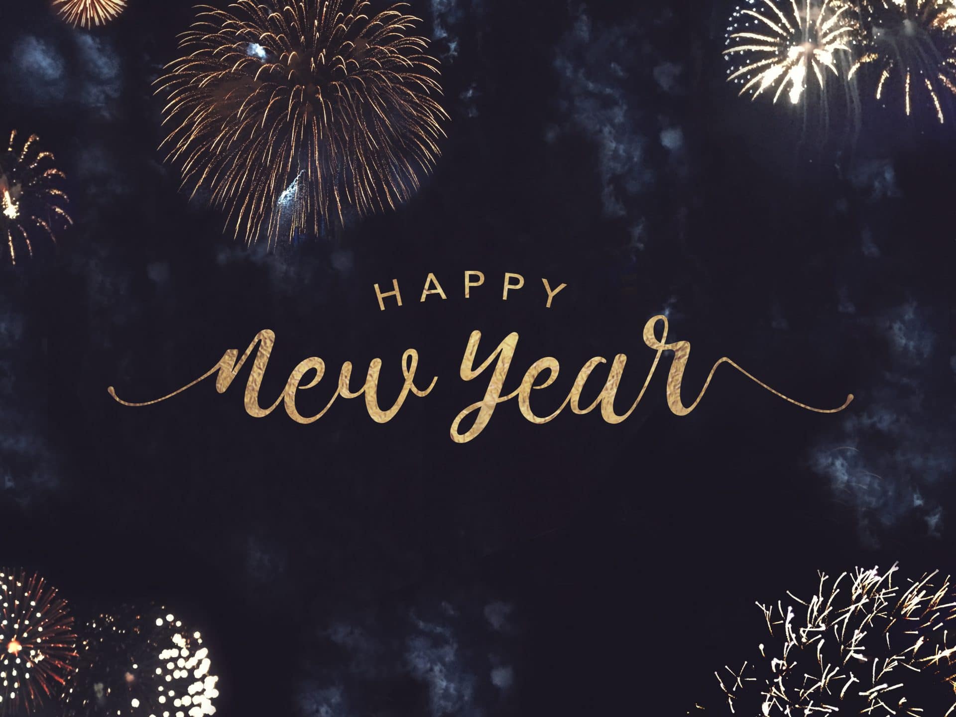 Happy New Year Celebration Text with Festive Gold Fireworks Collage in