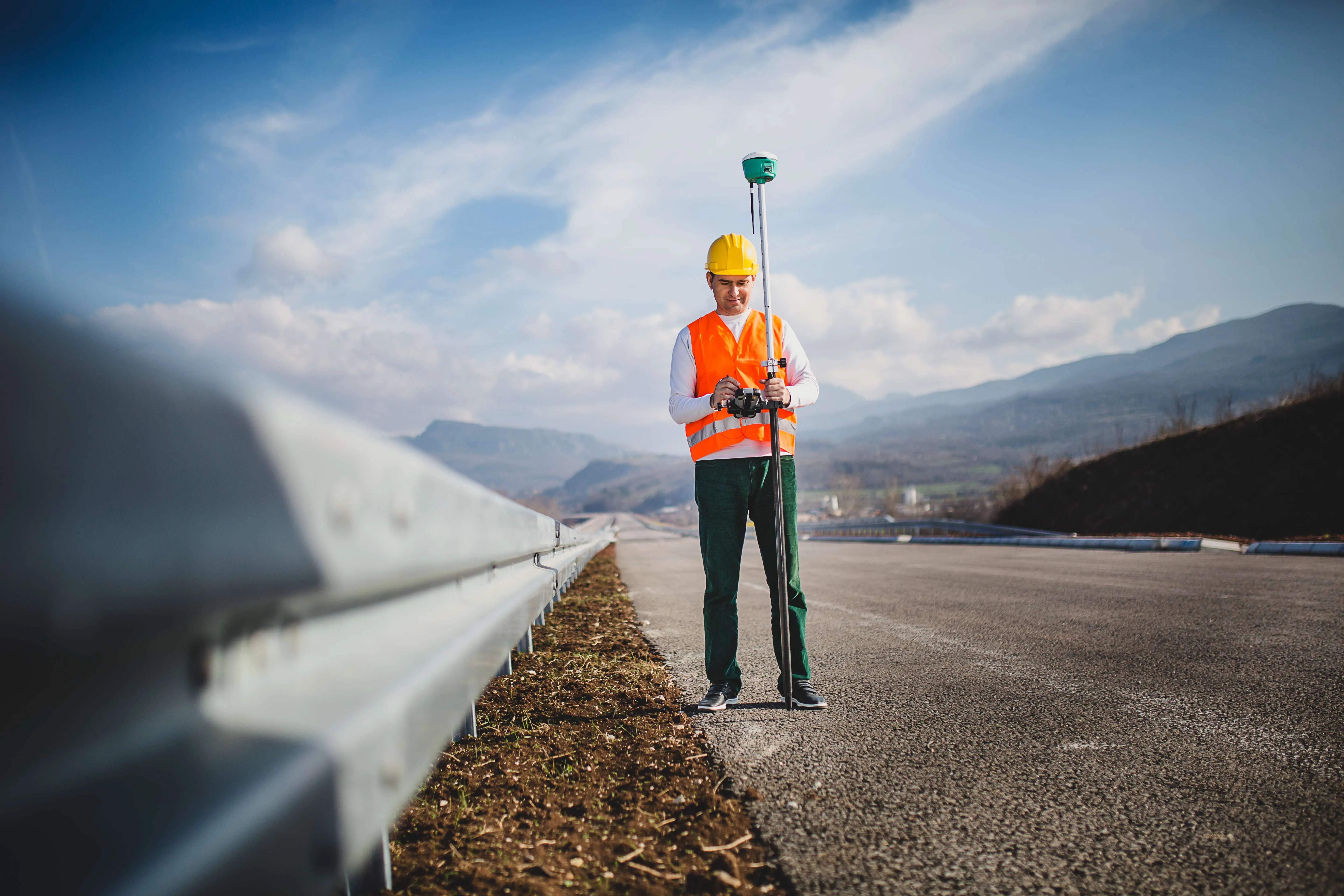 Land surveyor working with a GPS unit Traverse PC