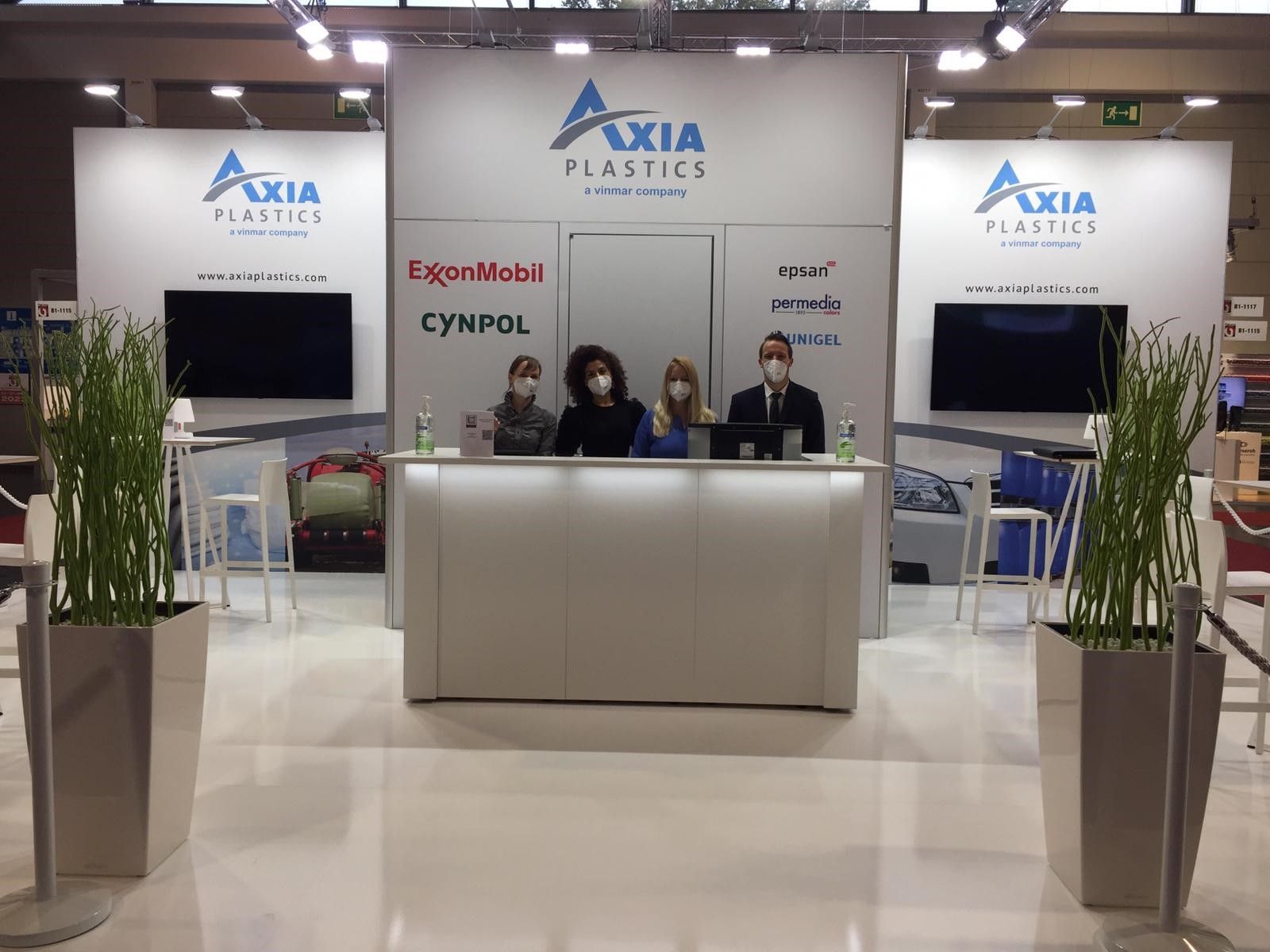 Tribe Design creates custom booth design for Axia Plastics. Tribe