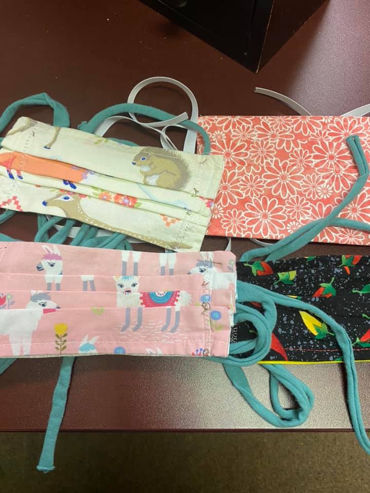 Team member joins volunteers to make masks Turenne PharMedCo Pharmacy