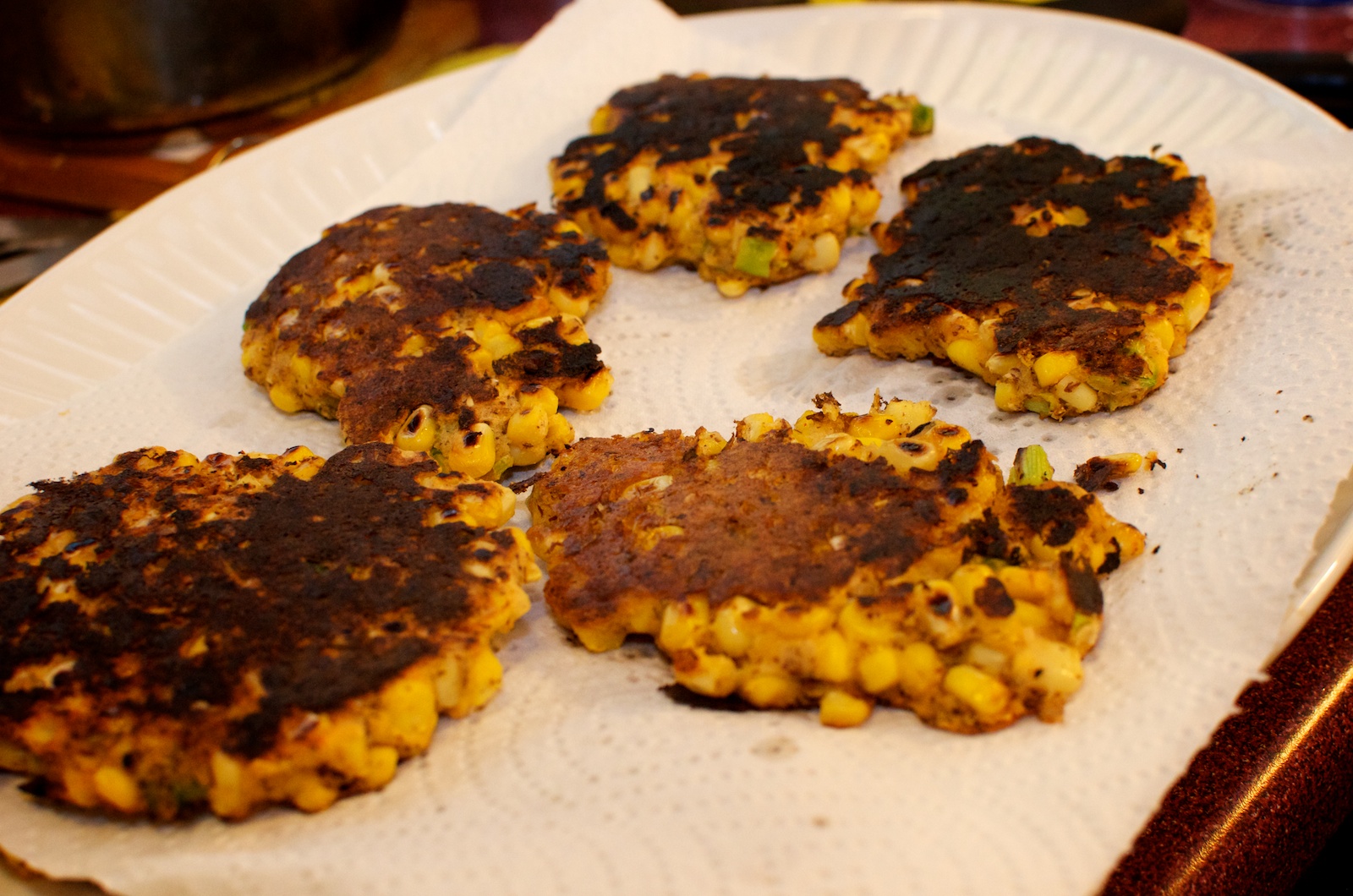 Corn Fritters with Sweet Chili Sauce, Black Beans, Beets, & Collard