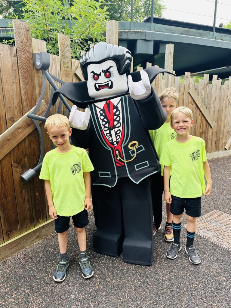 Three boys meet Dracula lego model at Legoland