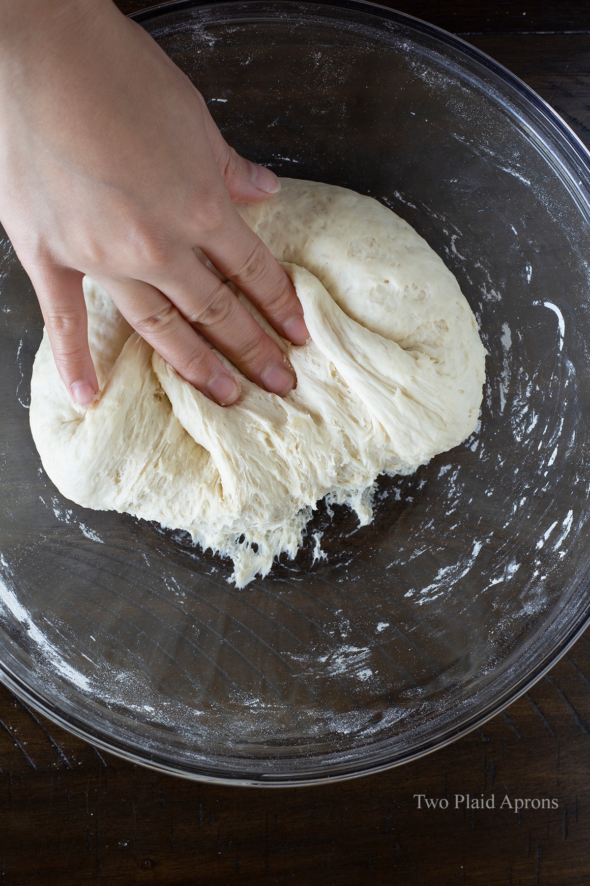 Folding the bao bun dough onto itself after 1st fermentation.