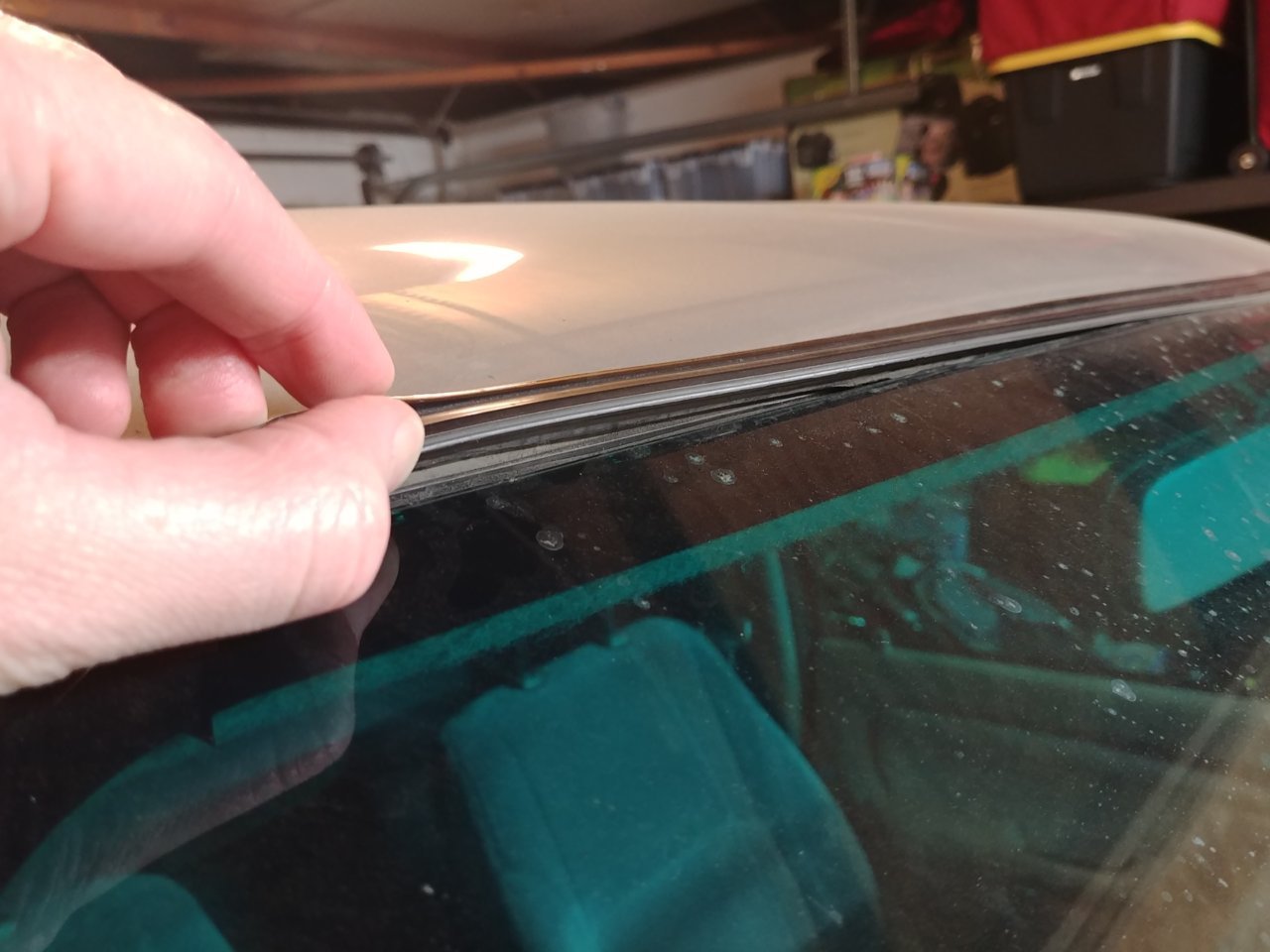 Weather stripping around windshield coming off World