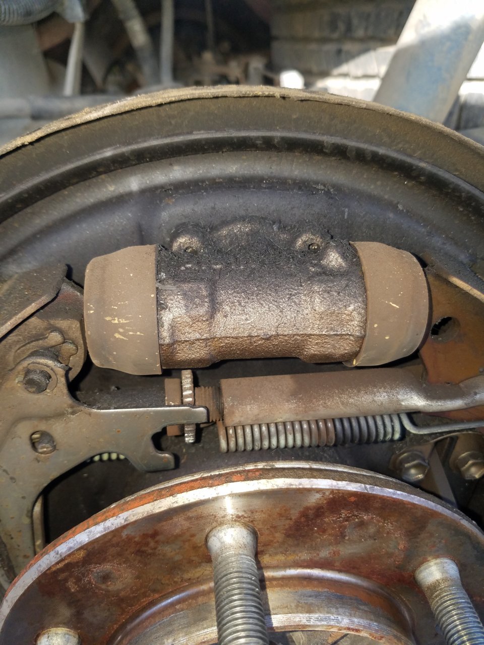 Squishy brake pedal, fluid inside drum, possible axle seal leak or