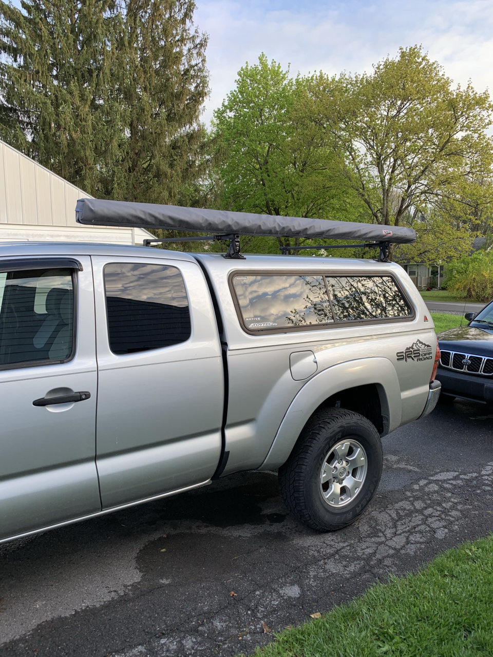 Leer Cap w/ thule rack and ARB awning World