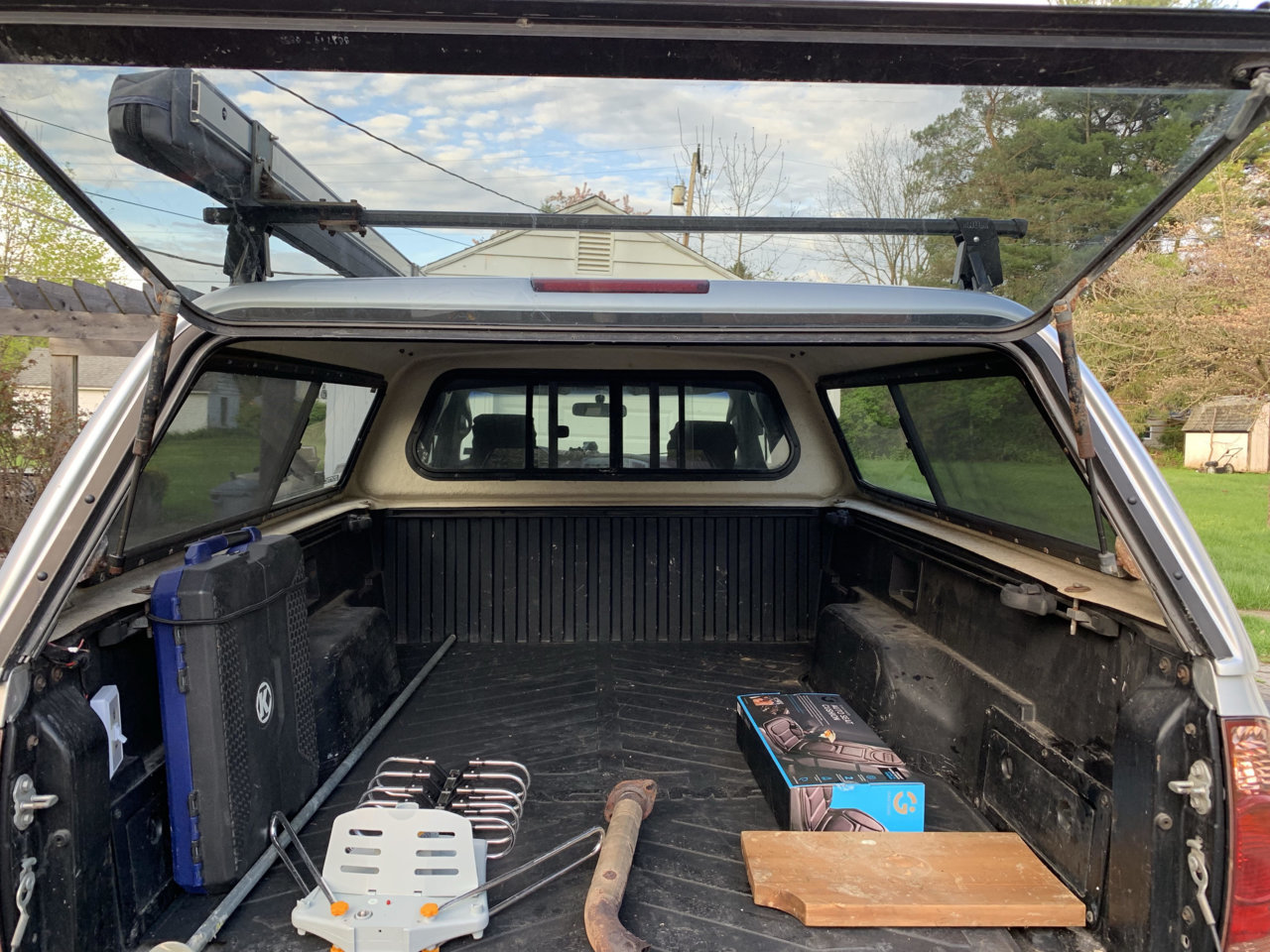 Leer Cap w/ thule rack and ARB awning World