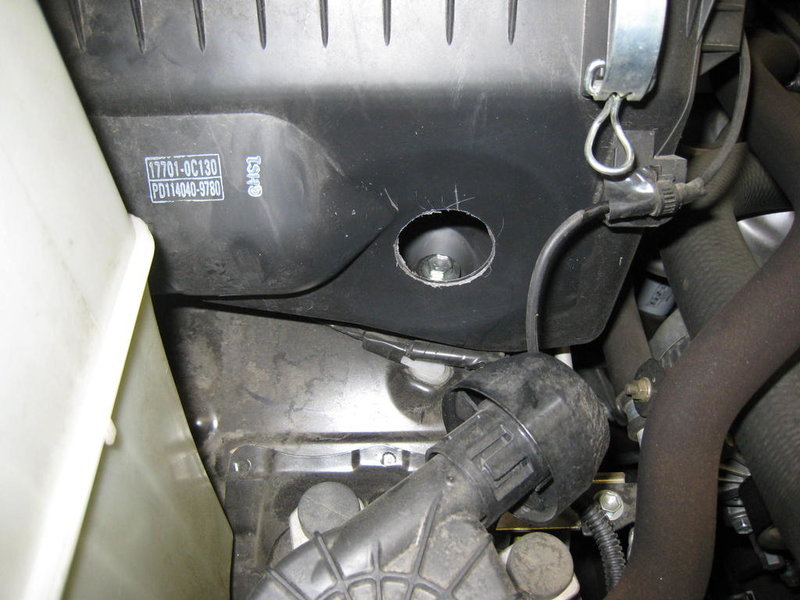 Drilled hole in air filter box... World