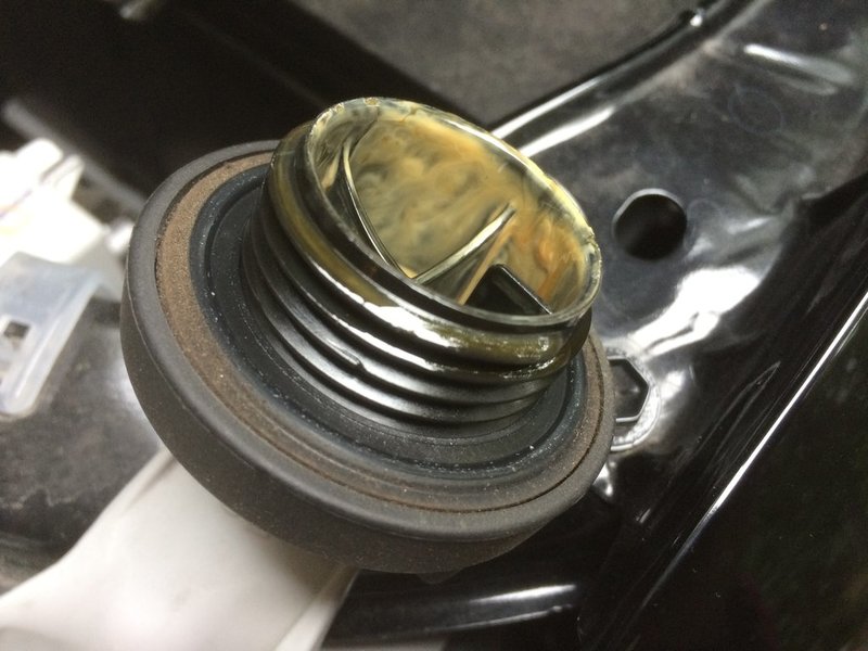 Yellow sludge inside oil fill cap normal? World